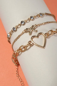 JOSSLYN by Wall to Wall - MULTI LAYER BOW HEART STATION RHINESTONE BRACELET